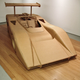 Image for article titled Artist Builds Amazing Vintage Racer From Cardboard And Hot Glue